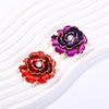 Emma Ruffled Peony Enamel Brooch - A round, elegant brooch featuring an array of ruffled petals clustered around a small round pearl.