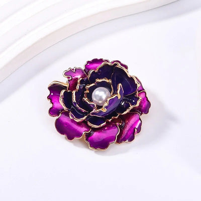 Emma Ruffled Peony Enamel Brooch - A round, elegant brooch featuring an array of ruffled petals clustered around a small round pearl.