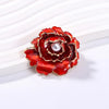 Emma Ruffled Peony Enamel Brooch - A round, elegant brooch featuring an array of ruffled petals clustered around a small round pearl.