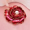 Emma Ruffled Peony Enamel Brooch - A round, elegant brooch featuring an array of ruffled petals clustered around a small round pearl.