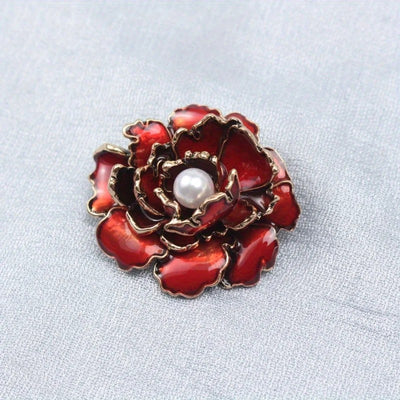 Emma Ruffled Peony Enamel Brooch - A round, elegant brooch featuring an array of ruffled petals clustered around a small round pearl.