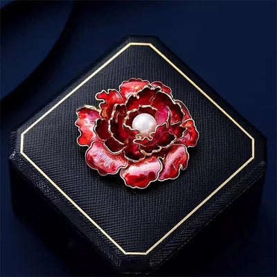Emma Ruffled Peony Enamel Brooch - A round, elegant brooch featuring an array of ruffled petals clustered around a small round pearl.