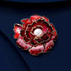Emma Ruffled Peony Enamel Brooch - A round, elegant brooch featuring an array of ruffled petals clustered around a small round pearl.
