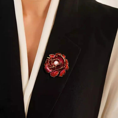 Emma Ruffled Peony Enamel Brooch - A round, elegant brooch featuring an array of ruffled petals clustered around a small round pearl.
