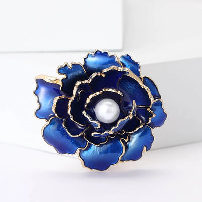 Emma Ruffled Peony Enamel Brooch - A round, elegant brooch featuring an array of ruffled petals clustered around a small round pearl.