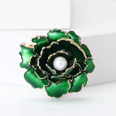 Emma Ruffled Peony Enamel Brooch - A round, elegant brooch featuring an array of ruffled petals clustered around a small round pearl.