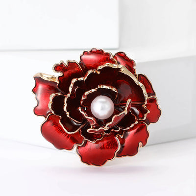 Emma Ruffled Peony Enamel Brooch - A round, elegant brooch featuring an array of ruffled petals clustered around a small round pearl.