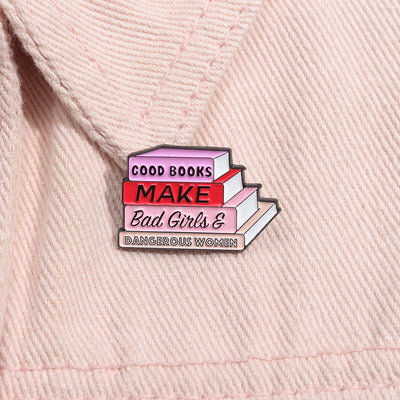 The "Good Books Make Bad Girls &amp; Dangerous Women" Enamel Pin is a small, stylish brooch featuring a stack of stylised books with text on the spines forming this very excellent and appropriate slogan. So true! Grab yours today!