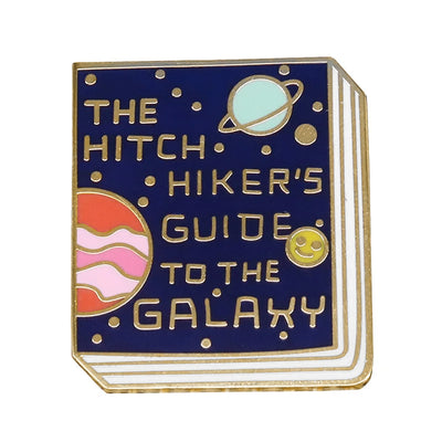 The "Hitchhiker's Guider" Enamel Pin features a stylised replica of the cult classic book, The Hitchhiker's Guide To The Galaxy, in vibrant coloured enamel paint, edged with metallic gold.
