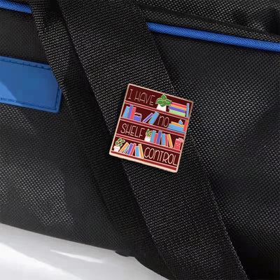 The "I Have No Shelf Control" Enamel Pin features a stylised bookshelf with large text proclaiming that you have no shelf control. So true.