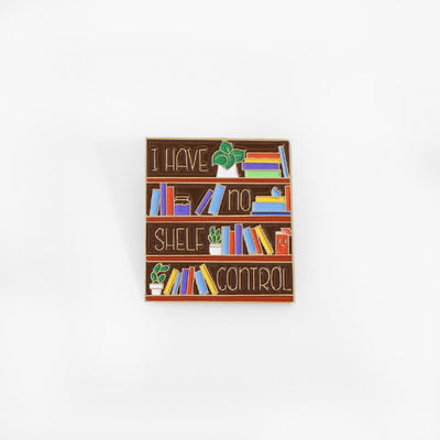 The "I Have No Shelf Control" Enamel Pin features a stylised bookshelf with large text proclaiming that you have no shelf control. So true.