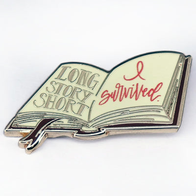 The "Long Story Short, I Survived" Enamel Pin is a small, stylish brooch featuring a stylised book with the text "Long Story Short, I Survived". Make of that what you will! Grab yours today!