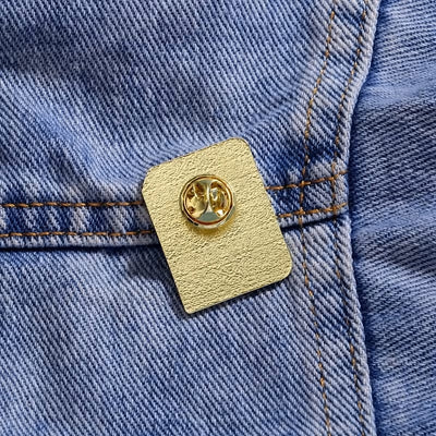 The "Romance Reader" Enamel Pin is a simple but elegant design, featuring a pink book outlined in gold, adorned with hearts. Perfect for expressing your love of the romance genre to all. Grab yours today!