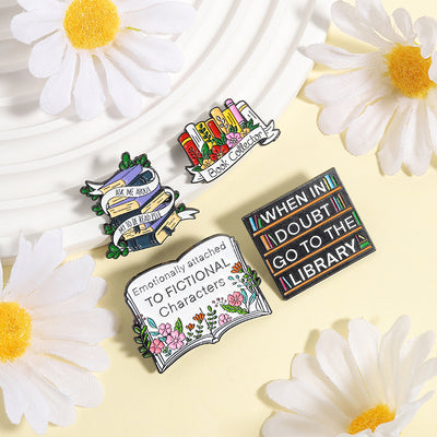 The "When In Doubt Go To The Library" Enamel Pin a large pin featuring a stylised bookshelf covered in books, and lettering proclaiming your love of all things library-related.