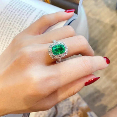 Esmeralda Adjustable Statement Ring - A large green crystal stone surrounded by smaller white quartz crystals.