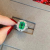 Esmeralda Adjustable Statement Ring - A large green crystal stone surrounded by smaller white quartz crystals.