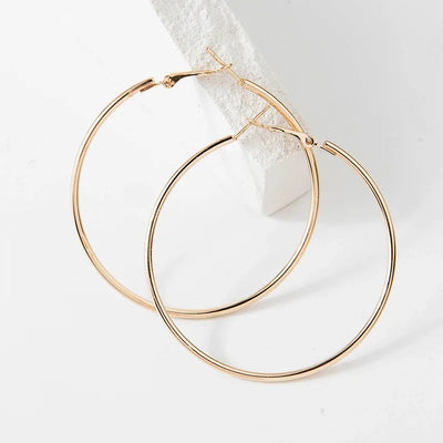 Essentials Steel Hoop Earrings - Fabulous large basic hoop earrings available in gold, rose gold, silver, or black enamel, and six different sizes ranging from 30mm to 80mm.