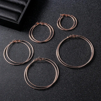 Essentials Steel Hoop Earrings - Fabulous large basic hoop earrings available in gold, rose gold, silver, or black enamel, and six different sizes ranging from 30mm to 80mm.