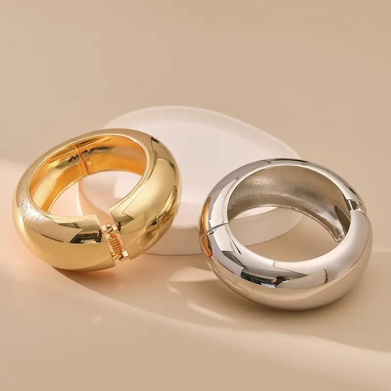 Evelyn Hinged Cuff Bangle - A simple round gold bangle with a mirrored finish, available in champagne or white gold.