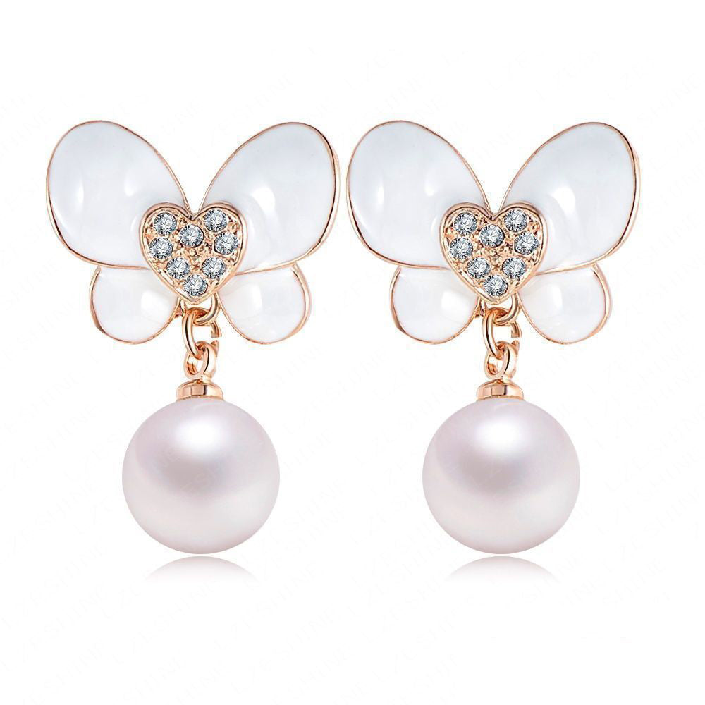Flutterdrop Pearlescent Butterfly Earrings - Small stud earrings with a butterfly and pearl motif.