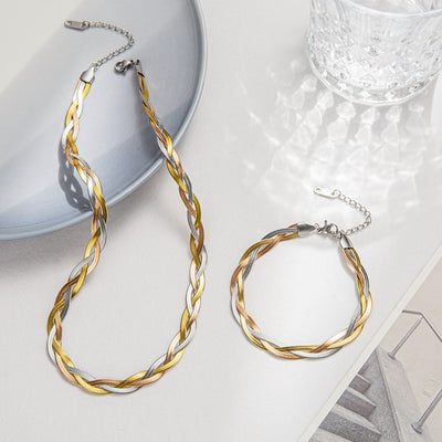 Gaelyn Tricolour Braided Snake Chain Bracelet & Necklace Set - A stylish metal jewellery set made from alternating strands of yellow, white, and rose gold, braided together into a tricolour necklace and bracelet.