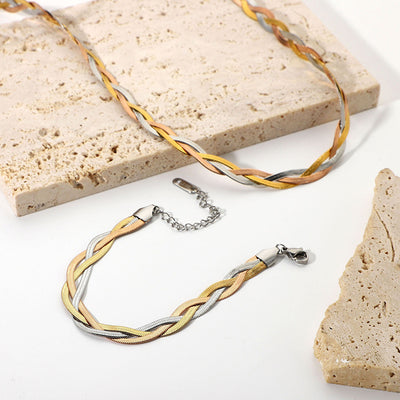 Gaelyn Tricolour Braided Snake Chain Bracelet & Necklace Set - A stylish metal jewellery set made from alternating strands of yellow, white, and rose gold, braided together into a tricolour necklace and bracelet.