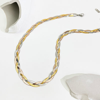 Gaelyn Tricolour Braided Snake Chain Bracelet & Necklace Set - A stylish metal jewellery set made from alternating strands of yellow, white, and rose gold, braided together into a tricolour necklace and bracelet.