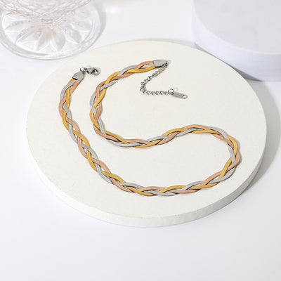 Gaelyn Tricolour Braided Snake Chain Bracelet & Necklace Set - A stylish metal jewellery set made from alternating strands of yellow, white, and rose gold, braided together into a tricolour necklace and bracelet.