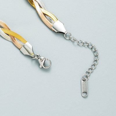 Gaelyn Tricolour Braided Snake Chain Bracelet & Necklace Set - A stylish metal jewellery set made from alternating strands of yellow, white, and rose gold, braided together into a tricolour necklace and bracelet.