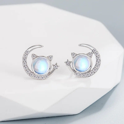 The Galactic Gatto Moonstone Cat Set - A very delicate cat-themed set featuring a small round moonstone for the cat's head, with stylised cat ears, stars, and moons.