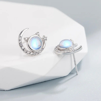 The Galactic Gatto Moonstone Cat Set - A very delicate cat-themed set featuring a small round moonstone for the cat's head, with stylised cat ears, stars, and moons.