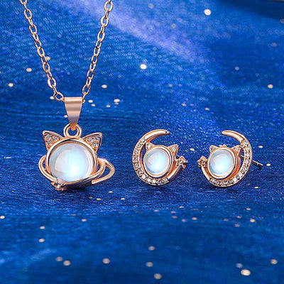 The Galactic Gatto Moonstone Cat Set - A very delicate cat-themed set featuring a small round moonstone for the cat's head, with stylised cat ears, stars, and moons.