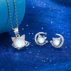 The Galactic Gatto Moonstone Cat Set - A very delicate cat-themed set featuring a small round moonstone for the cat's head, with stylised cat ears, stars, and moons.