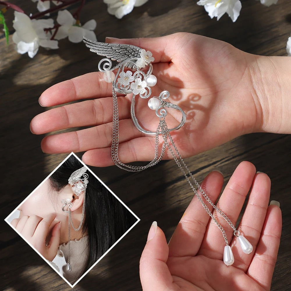 Galadriel Elven Ear Cuff Set - An elegant curved ear cuff designed to resemble the shape of an elf ear, decorated with pearls, flowers, and a silver angel wing.