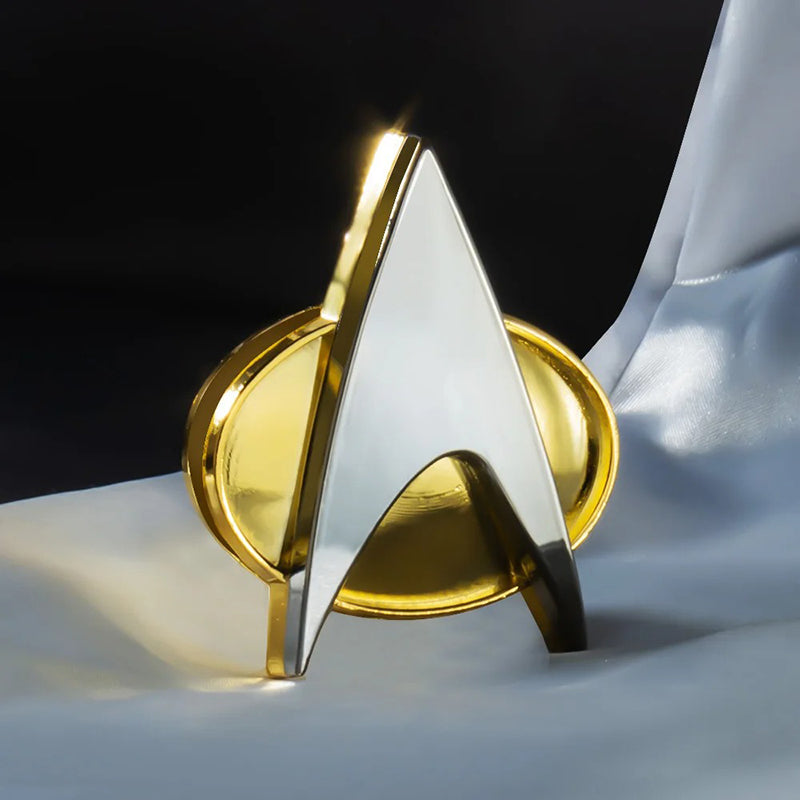 Go Boldly Magnetic Replica Com Badge - A life-sized replica of the classic Star Trek communication badge, in shiny gold and silver metal.