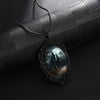 Gothic Castle Cameo Necklace - A large gothic glass cabochon featuring an image of a spooky castle against a cloudy night sky with a huge full moon.