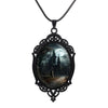 Gothic Castle Cameo Necklace - A large gothic glass cabochon featuring an image of a spooky castle against a cloudy night sky with a huge full moon.