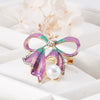 Grace Ribbon Bow Brooch - A lovely feminine brooch shaped like a stylised pink-and-green sparkly ribbon tied in a bow.