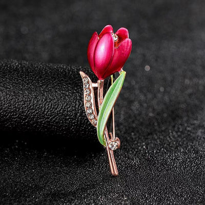 The Gretchen Enamel Tulip Brooch - A tall, slender enamel flower brooch with a colourful flower head and delicate round crystals along one of the leads.