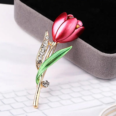 The Gretchen Enamel Tulip Brooch - A tall, slender enamel flower brooch with a colourful flower head and delicate round crystals along one of the leads.