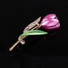 The Gretchen Enamel Tulip Brooch - A tall, slender enamel flower brooch with a colourful flower head and delicate round crystals along one of the leads.