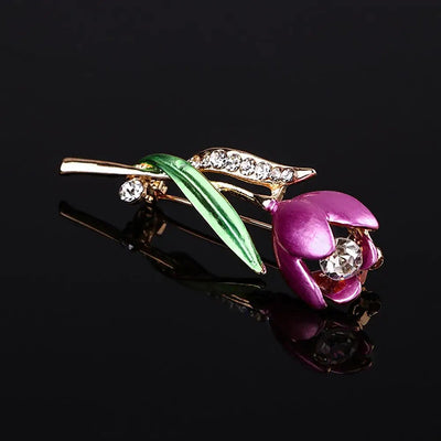 The Gretchen Enamel Tulip Brooch - A tall, slender enamel flower brooch with a colourful flower head and delicate round crystals along one of the leads.