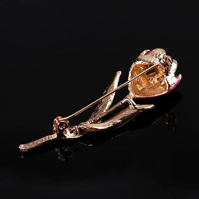 The Gretchen Enamel Tulip Brooch - A tall, slender enamel flower brooch with a colourful flower head and delicate round crystals along one of the leads.