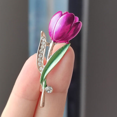 The Gretchen Enamel Tulip Brooch - A tall, slender enamel flower brooch with a colourful flower head and delicate round crystals along one of the leads.