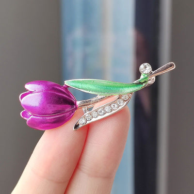 The Gretchen Enamel Tulip Brooch - A tall, slender enamel flower brooch with a colourful flower head and delicate round crystals along one of the leads.