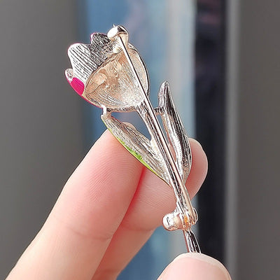 The Gretchen Enamel Tulip Brooch - A tall, slender enamel flower brooch with a colourful flower head and delicate round crystals along one of the leads.