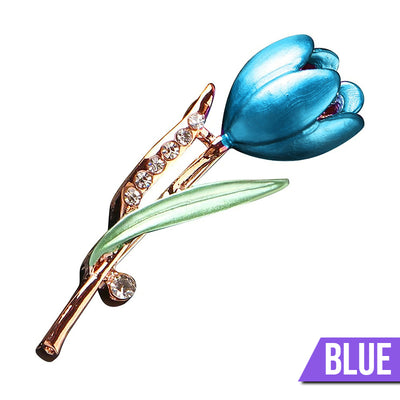 The Gretchen Enamel Tulip Brooch - A tall, slender enamel flower brooch with a colourful flower head and delicate round crystals along one of the leads.