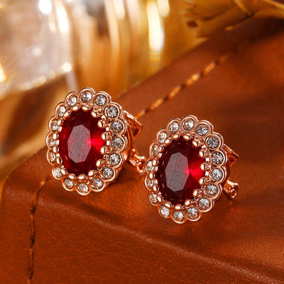 Hailee Entourage Clip Earrings - Ultra-petite, vintage-style clip-on earrings featuring a single coloured stone surrounded by 16 smaller stones.