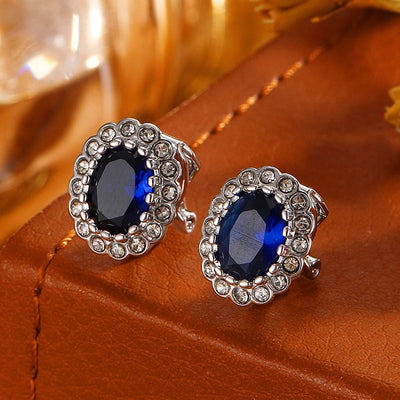 Hailee Entourage Clip Earrings - Ultra-petite, vintage-style clip-on earrings featuring a single coloured stone surrounded by 16 smaller stones.