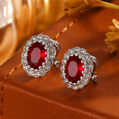 Hailee Entourage Clip Earrings - Ultra-petite, vintage-style clip-on earrings featuring a single coloured stone surrounded by 16 smaller stones.